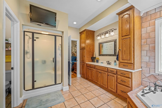 152 W Dr, Fyffe, AL 35971 - bathroom featuring a stall shower, tile patterned floors, a bath, vanity, and toilet