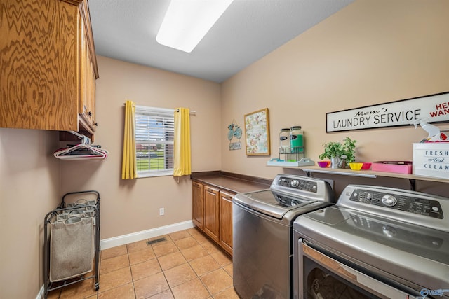 152 W Dr, Fyffe, AL 35971 - laundry room featuring cabinet space, washing machine and dryer, baseboards, and light tile patterned floors