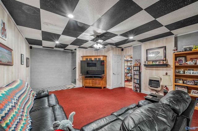 152 W Dr, Fyffe, AL 35971 - living area with carpet flooring, heating unit, ceiling fan, and wood walls