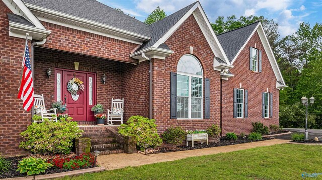 152 W Dr, Fyffe, AL 35971 - view of front facade featuring brick siding, a front yard, and a shingled roof