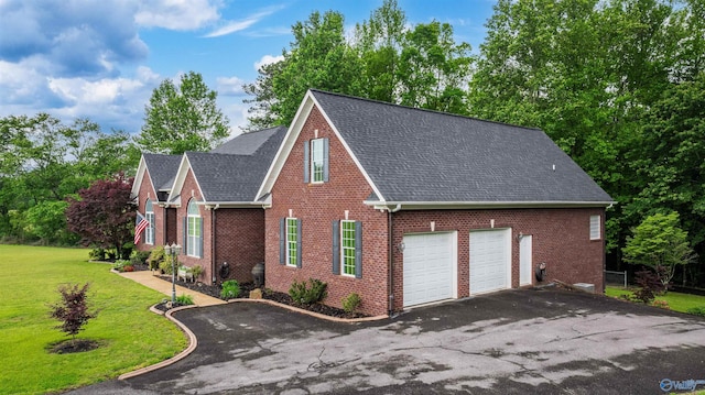 152 W Dr, Fyffe, AL 35971 - view of front facade featuring driveway, brick siding, roof with shingles, and a front yard
