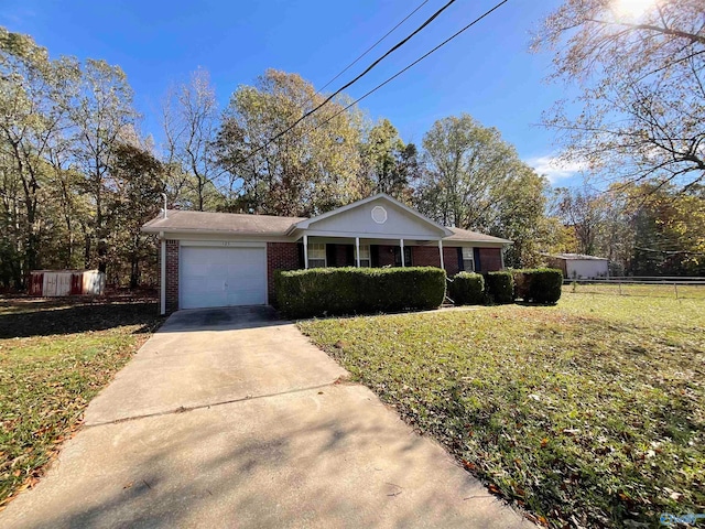 ranch-style home with a garage and a front yard