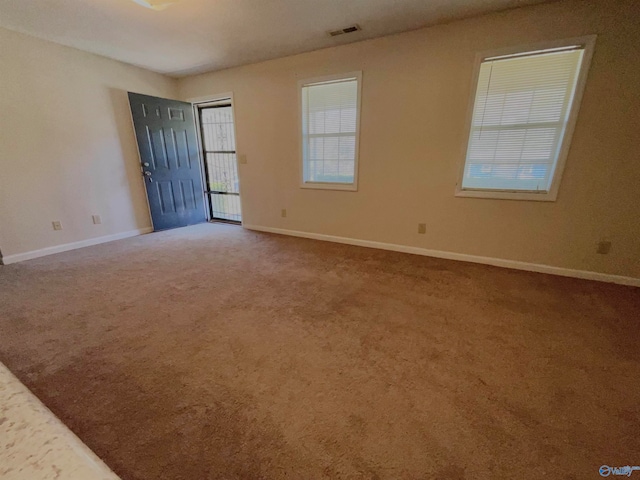 spare room featuring carpet floors