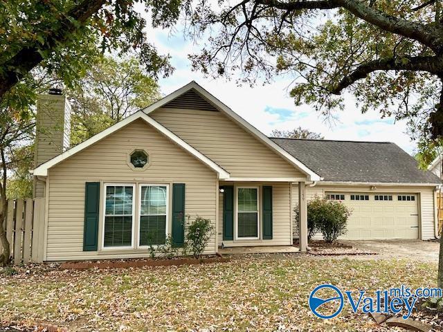 ranch-style home with a garage