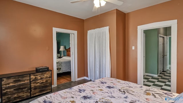 bedroom featuring baseboards, a ceiling fan, and tile patterned floors