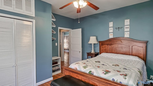 bedroom featuring ceiling fan, a closet, wood finished floors, and baseboards