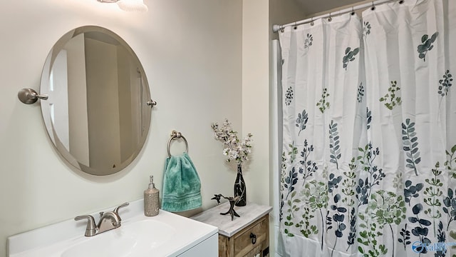 bathroom featuring vanity and a shower with shower curtain