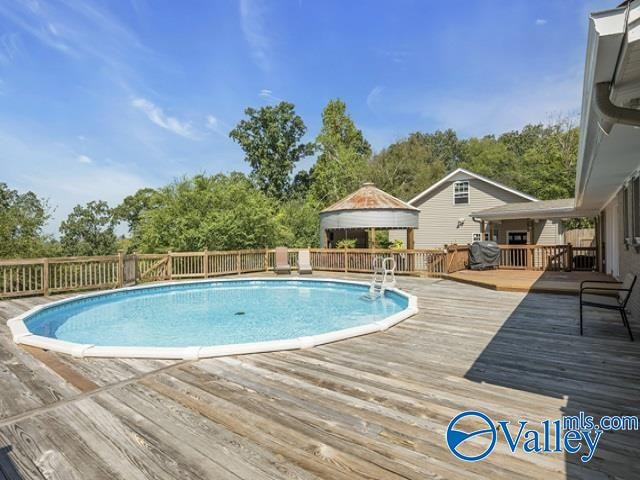 view of pool featuring a deck