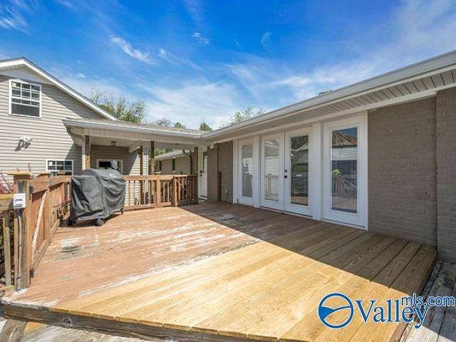 wooden terrace with grilling area