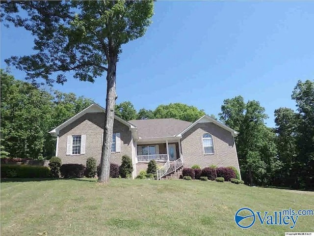 430 Timber Trl, Ashville, AL 35953 - view of front facade featuring a front yard, a porch, and brick siding