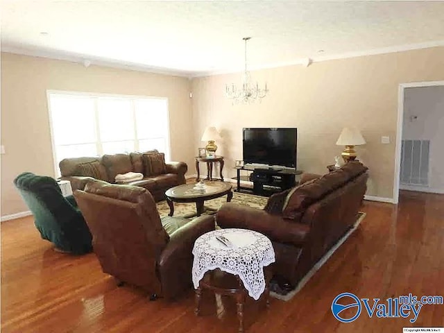 430 Timber Trl, Ashville, AL 35953 - living area featuring a chandelier, wood finished floors, and baseboards