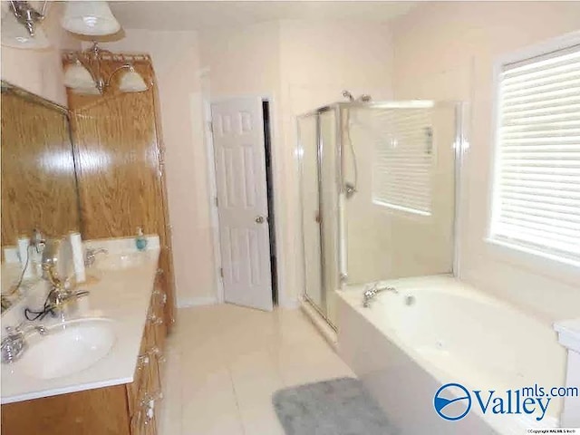 430 Timber Trl, Ashville, AL 35953 - bathroom with a stall shower, a garden tub, tile patterned flooring, and double vanity