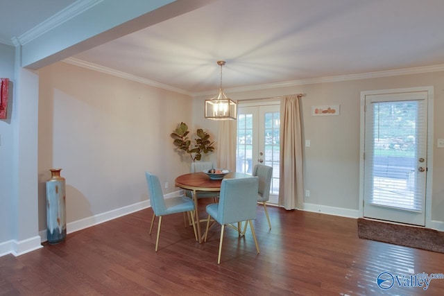 dining area featuring ornamental molding, dark hardwood / wood-style flooring, and french doors