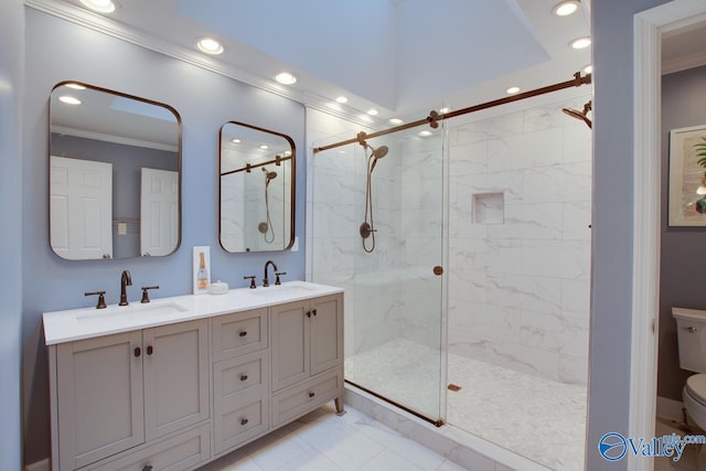 bathroom featuring an enclosed shower, vanity, ornamental molding, and toilet