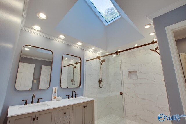 bathroom featuring crown molding, vanity, a skylight, and a shower with door