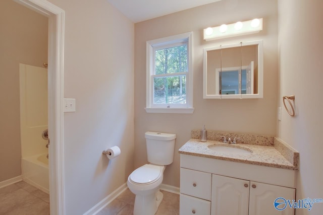 full bathroom featuring vanity, tile patterned floors, toilet, and shower / washtub combination