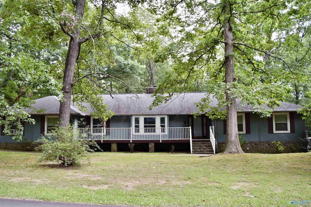 ranch-style house with a front lawn