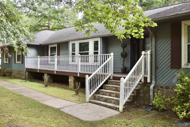 view of front of house with a deck