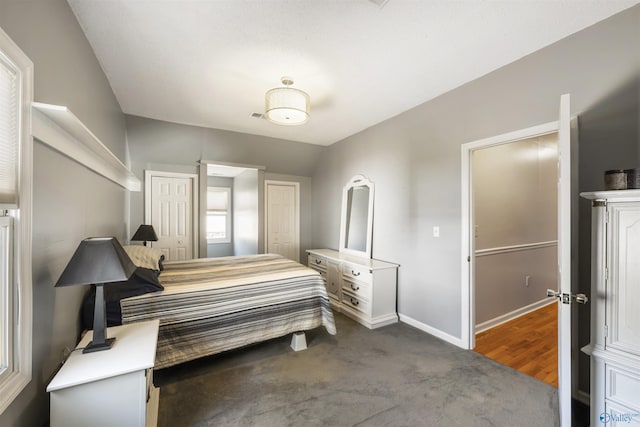 carpeted bedroom featuring baseboards