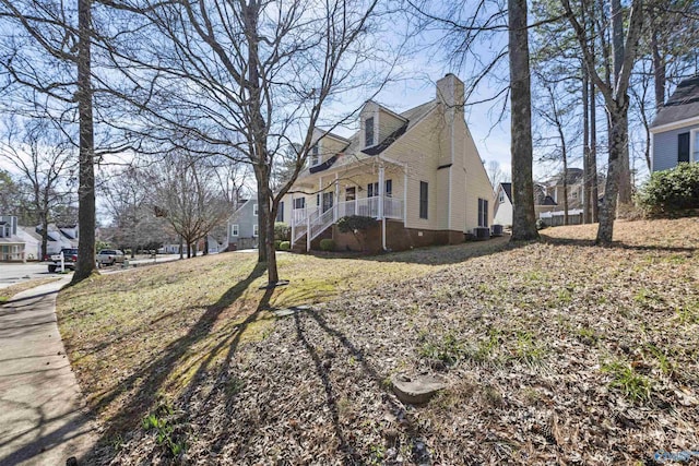 view of home's exterior featuring a residential view and a chimney