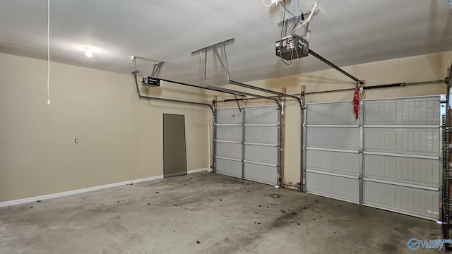 garage with baseboards and a garage door opener