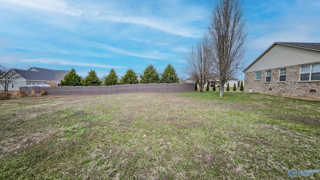 view of yard featuring fence