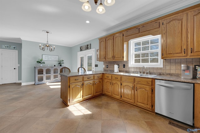 kitchen with sink, a notable chandelier, decorative light fixtures, stainless steel dishwasher, and decorative backsplash
