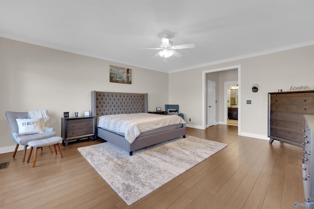 bedroom featuring crown molding, wood-type flooring, and ceiling fan