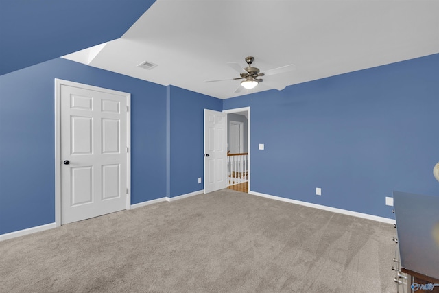 unfurnished bedroom with carpet floors and ceiling fan