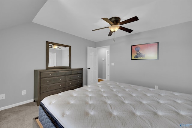 carpeted bedroom with lofted ceiling and ceiling fan