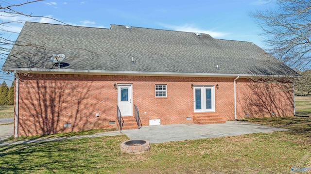 back of house with a patio and a yard