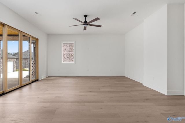201 Fame Ave, Tuscumbia, AL 35674 - empty room featuring light wood-style floors, baseboards, and a ceiling fan