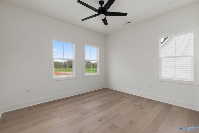 201 Fame Ave, Tuscumbia, AL 35674 - spare room with a ceiling fan, baseboards, visible vents, and light wood-style flooring