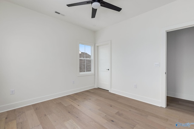 201 Fame Ave, Tuscumbia, AL 35674 - spare room featuring light wood-style floors, baseboards, ceiling fan, and visible vents