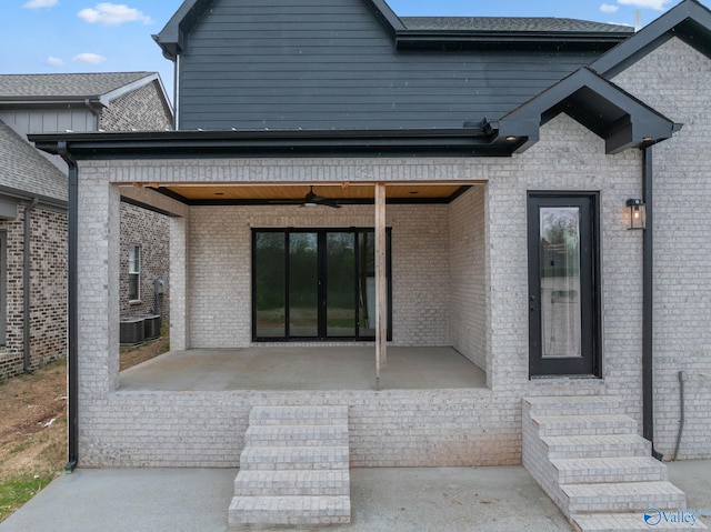 201 Fame Ave, Tuscumbia, AL 35674 - property entrance with a patio, a ceiling fan, central AC, and french doors
