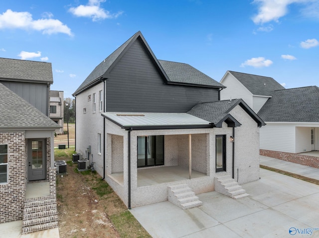 201 Fame Ave, Tuscumbia, AL 35674 - back of property featuring a patio, brick siding, and cooling unit