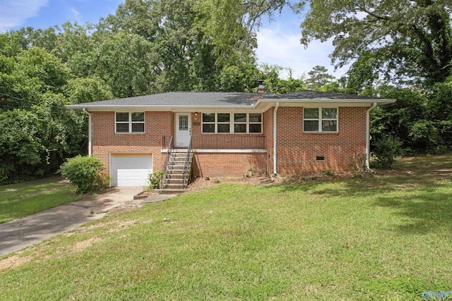 101 Arcade St, Gadsden, AL 35901 - ranch-style house with concrete driveway, brick siding, and a front lawn