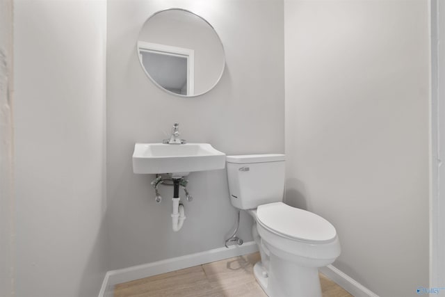 101 Arcade St, Gadsden, AL 35901 - half bathroom featuring toilet and baseboards