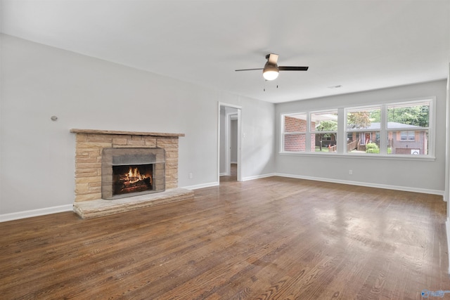 101 Arcade St, Gadsden, AL 35901 - unfurnished living room featuring a ceiling fan, a fireplace, and wood finished floors
