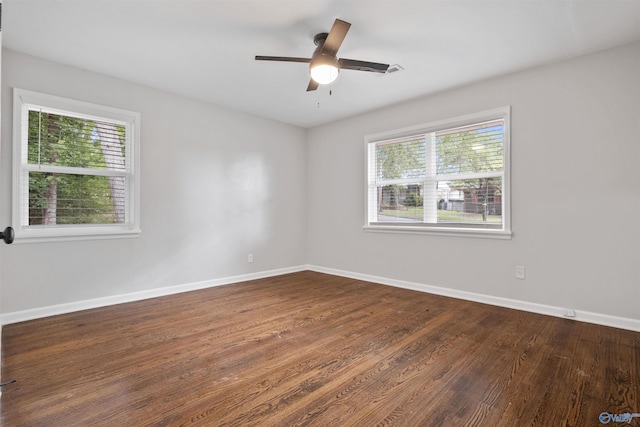 101 Arcade St, Gadsden, AL 35901 - spare room with healthy amount of natural light, dark wood-style flooring, and ceiling fan