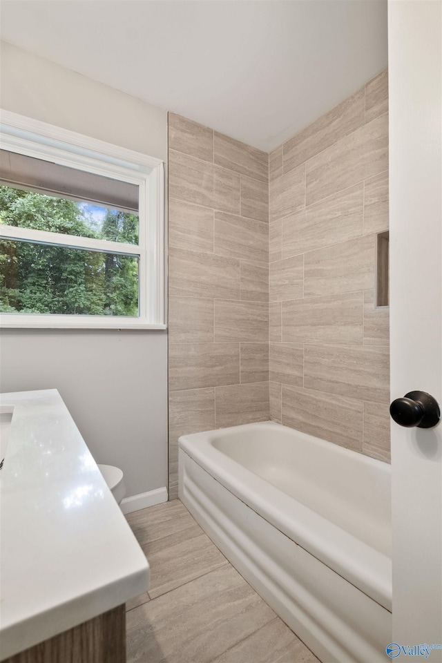 101 Arcade St, Gadsden, AL 35901 - full bath with wood finished floors, vanity, and shower / bath combination