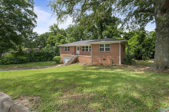 101 Arcade St, Gadsden, AL 35901 - ranch-style house featuring brick siding, a garage, a front lawn, and driveway