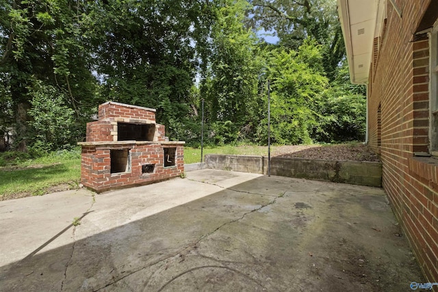 101 Arcade St, Gadsden, AL 35901 - view of patio / terrace featuring an outdoor brick fireplace