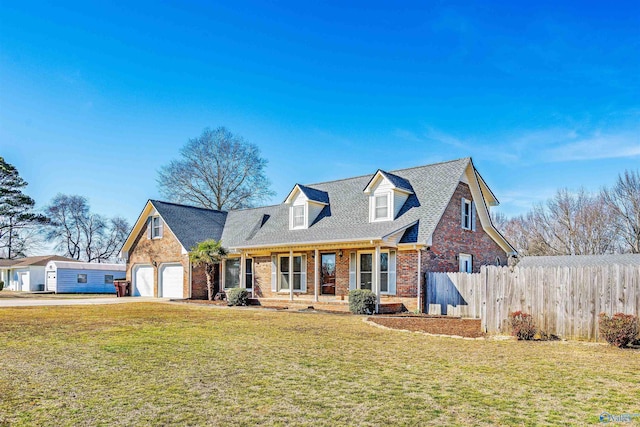 cape cod house with brick siding, concrete driveway, fence, a garage, and a front lawn