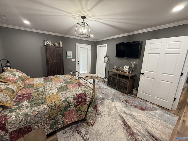 bedroom with crown molding, a chandelier, wood finished floors, and recessed lighting