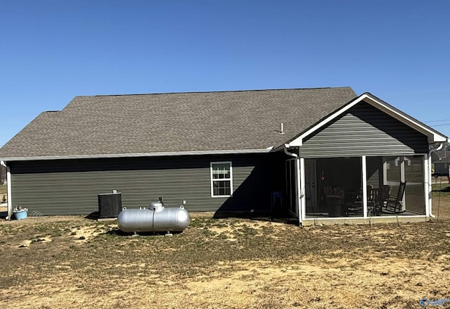 back of property featuring cooling unit and a sunroom