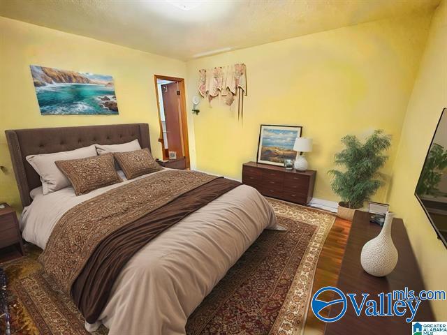 bedroom featuring dark wood-type flooring