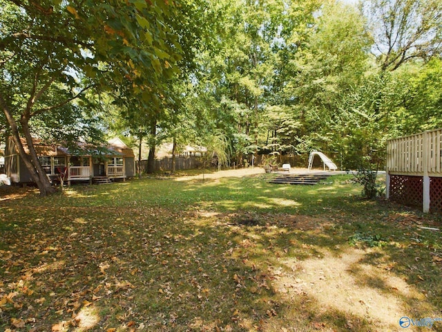 view of yard with a wooden deck