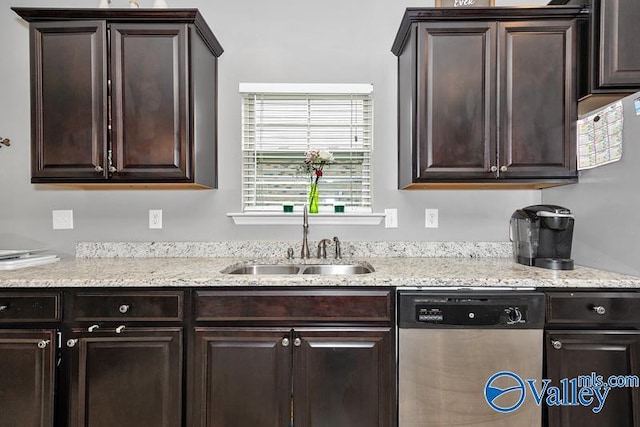 kitchen featuring dark brown cabinetry, sink, and dishwasher