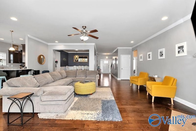 living room featuring crown molding, dark hardwood / wood-style floors, and ceiling fan